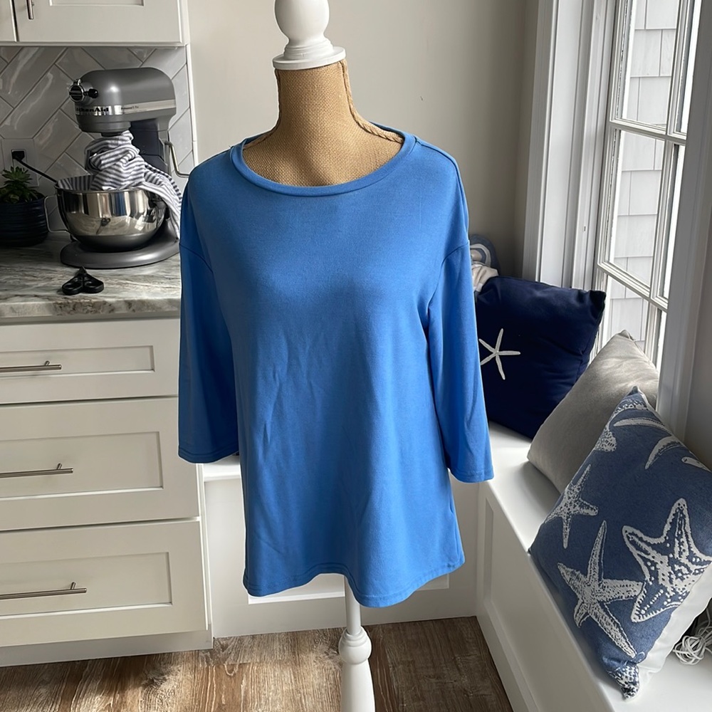 Philosophy’s soft blue quarter sleeve shirt with opening in the back